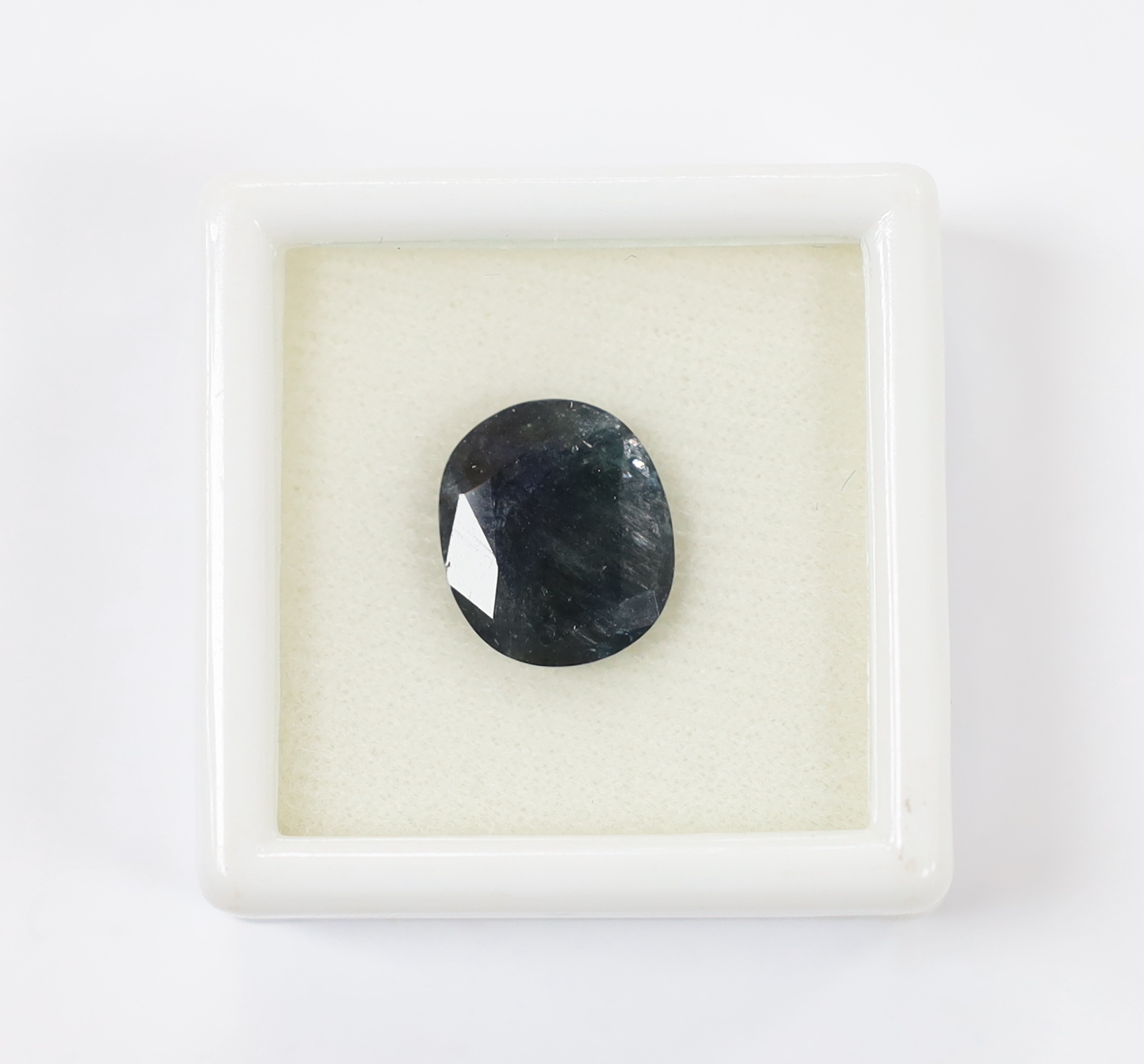 An unmounted cushion cut sapphire, weighing 8.67ct.